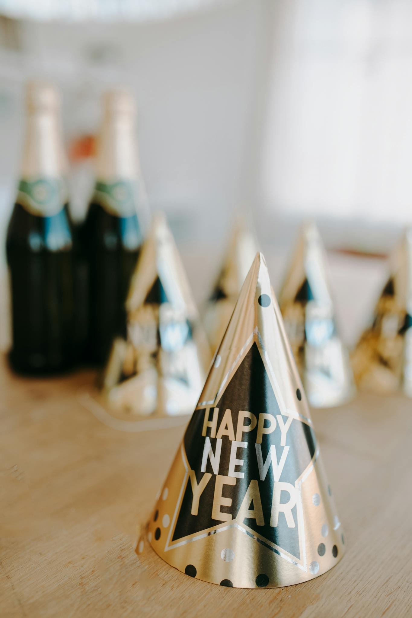 Celebratory New Year party setup with champagne and hats. Ideal for festive season imagery.